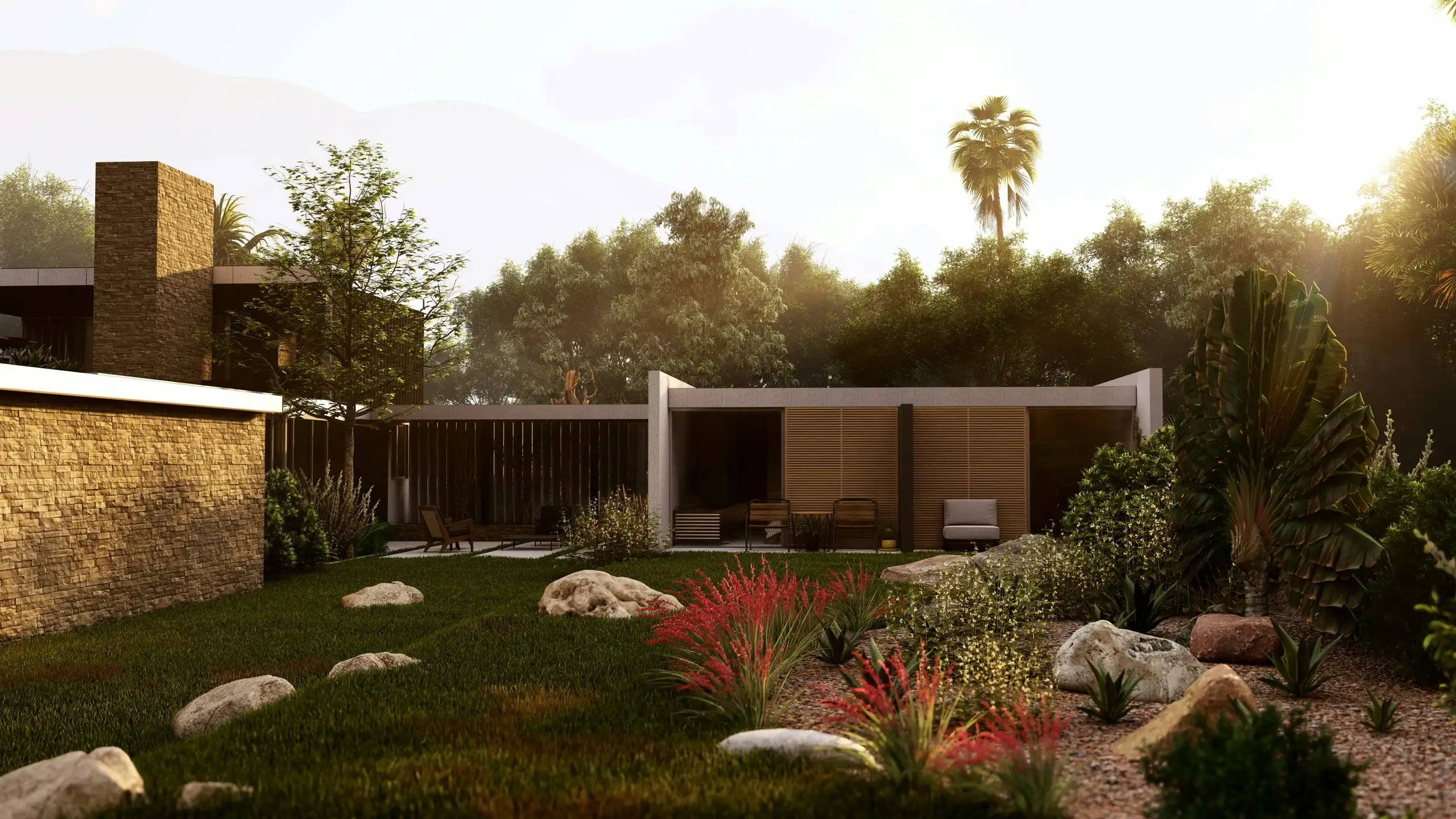 A low timber pavilion at sunset behind a lawn with boulders and red-flowering plants